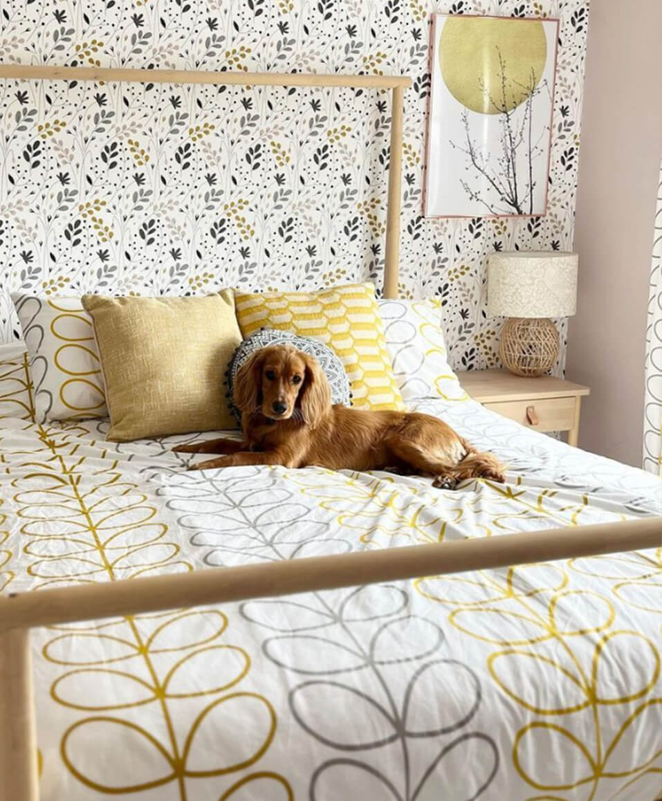Photo of customer's bedroom featuring Orla Kiely's Linear Stem Ochre bed linen