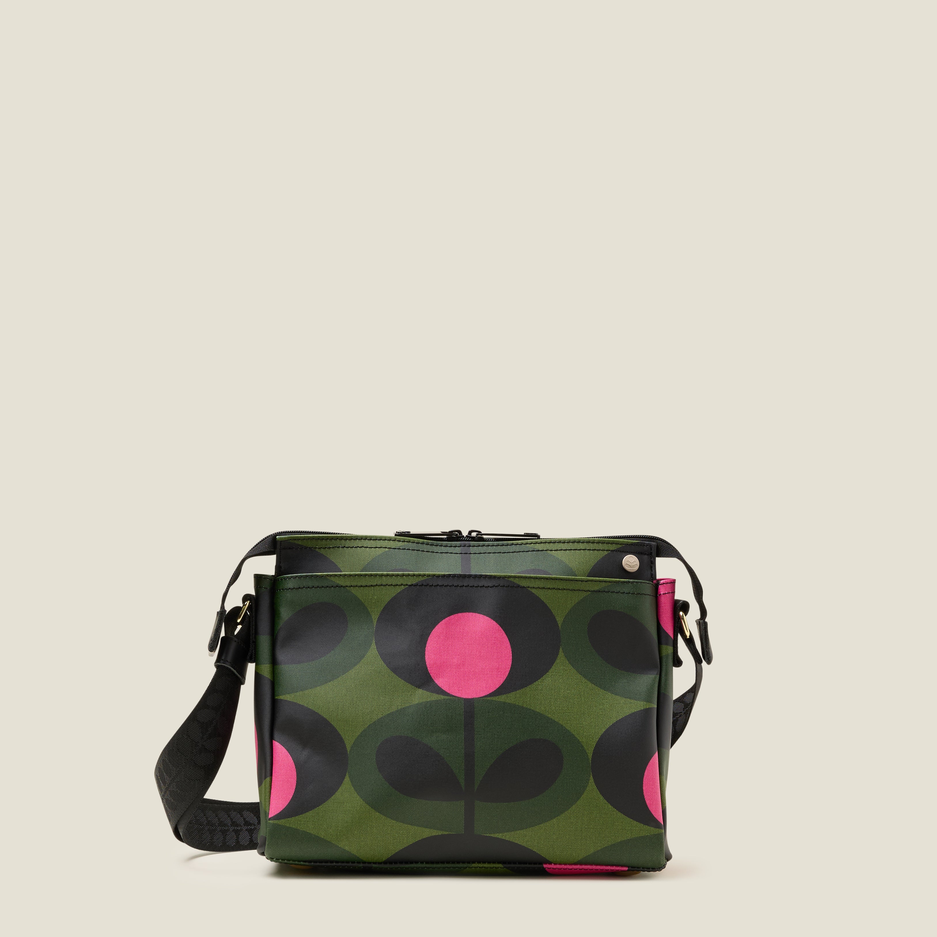 The forest green Fielder Crossbody bag front view with slip pocket and zip closure.