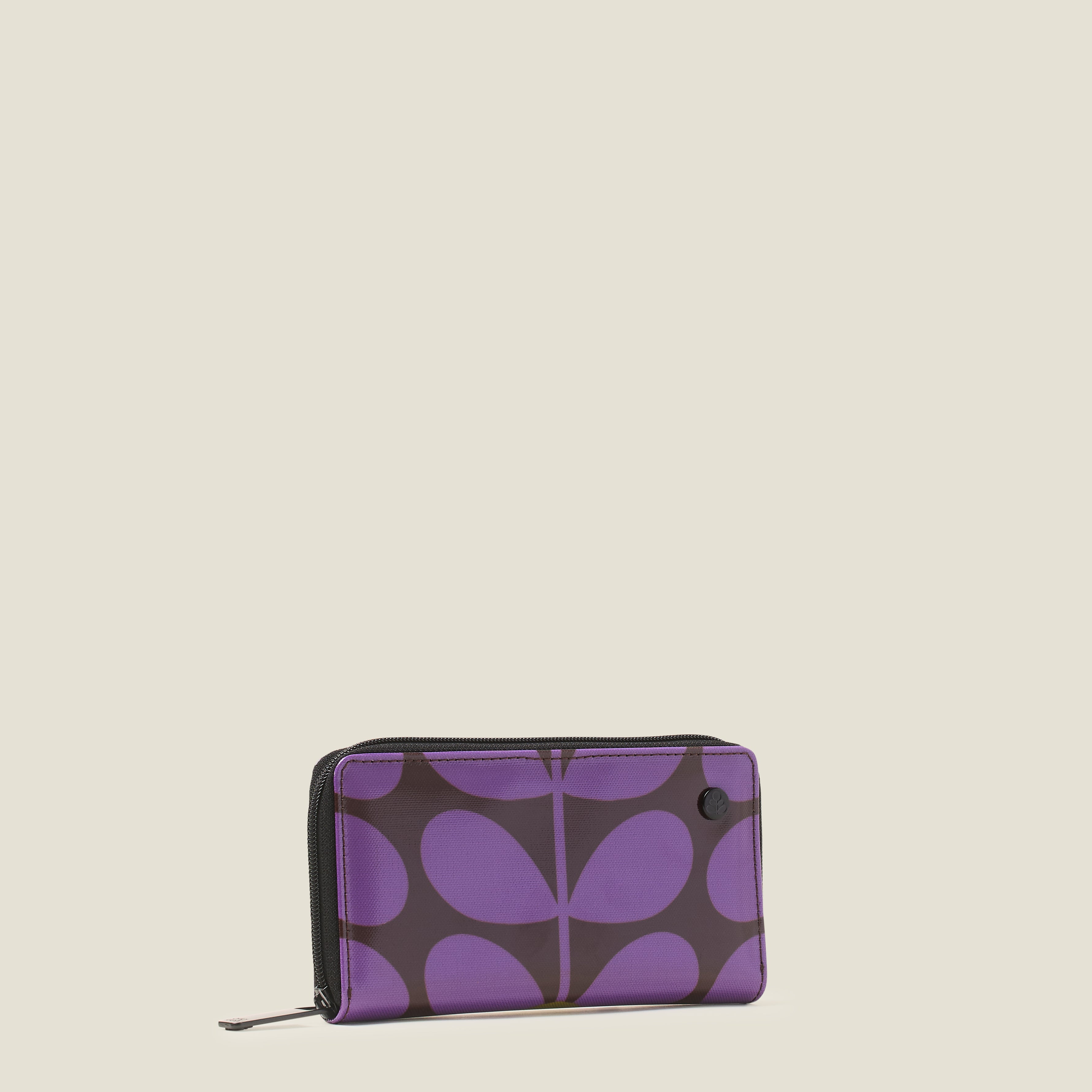 Side view of a retro print Forget Me Not Wallet in purple and brown with zip closure.