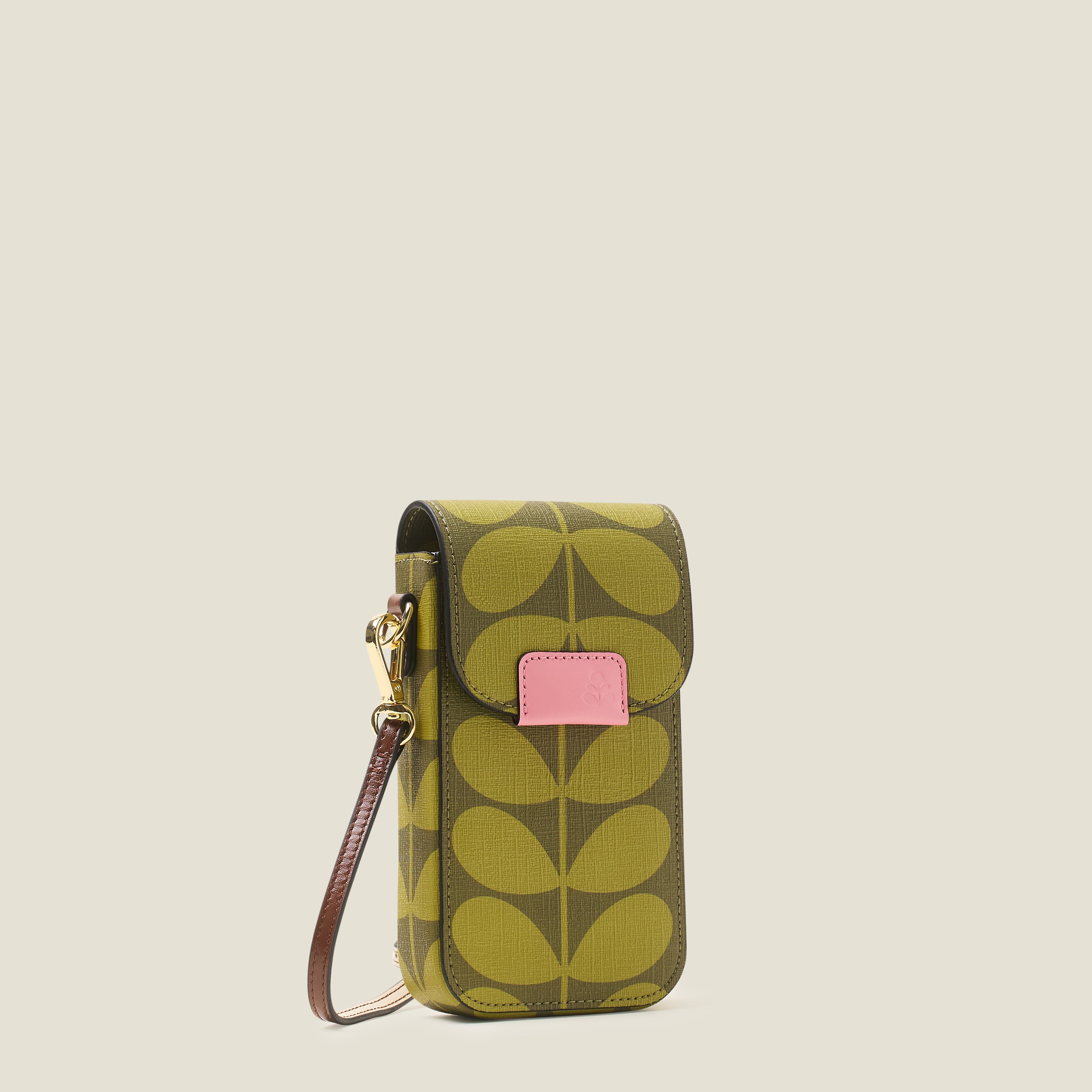 Side view of a green stem pattern phone case with a pink branded trim and crossbody strap on a beige background