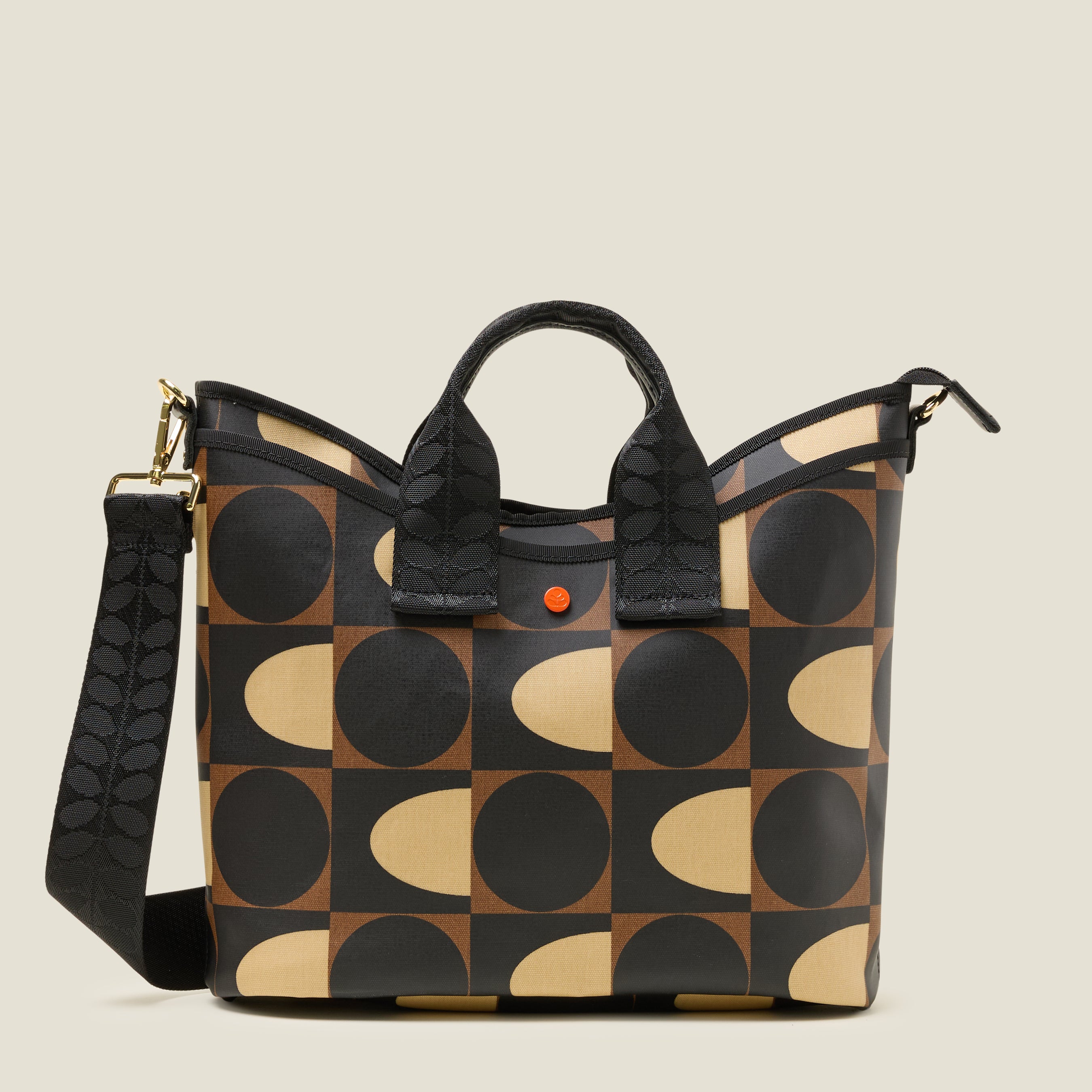 Front view of a patterned handbag, with slip pocket with geometric mocha brown print design
