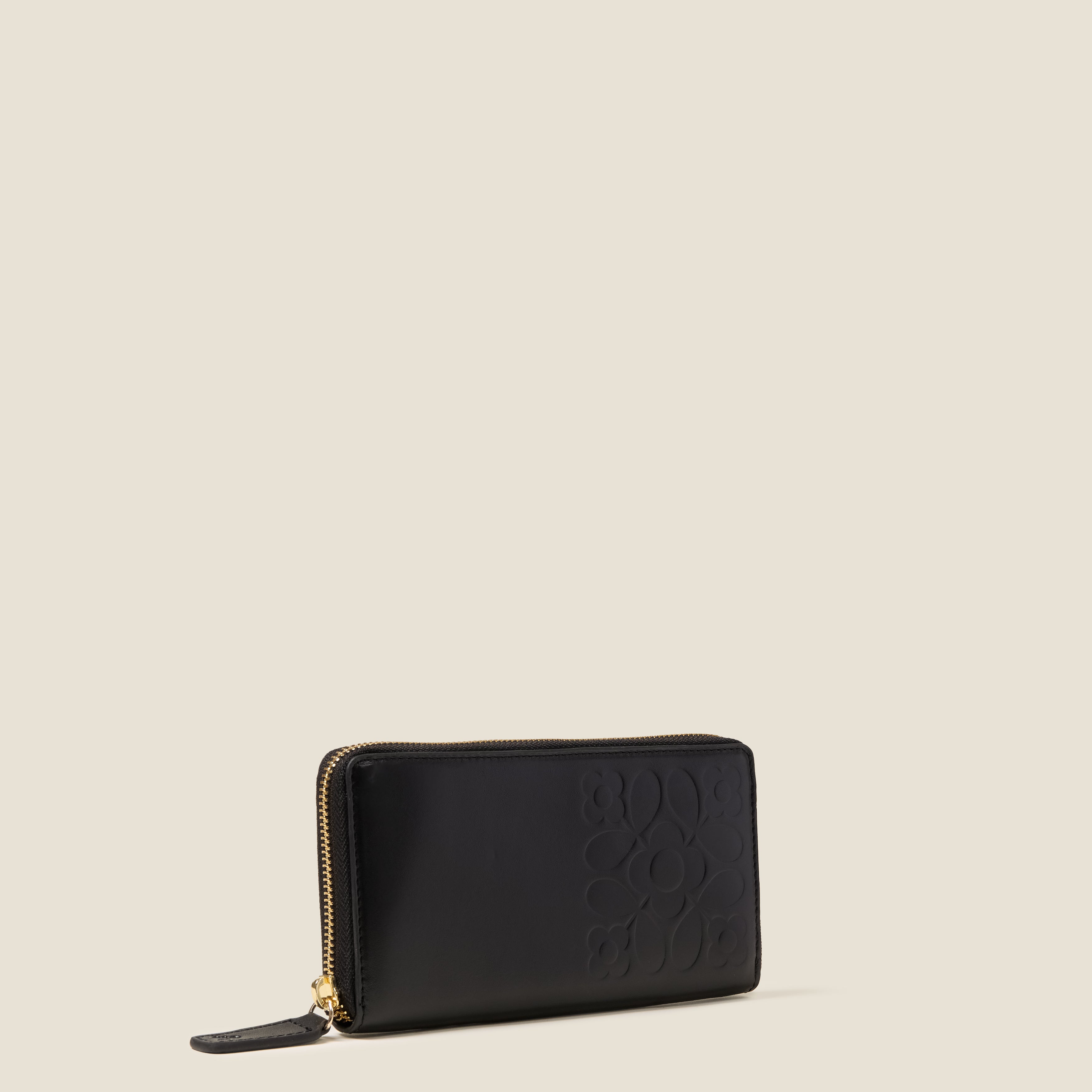 Side view of the Forget Me Not Wallet in black leather women's wallet with Orla Kiely pattern embossing.