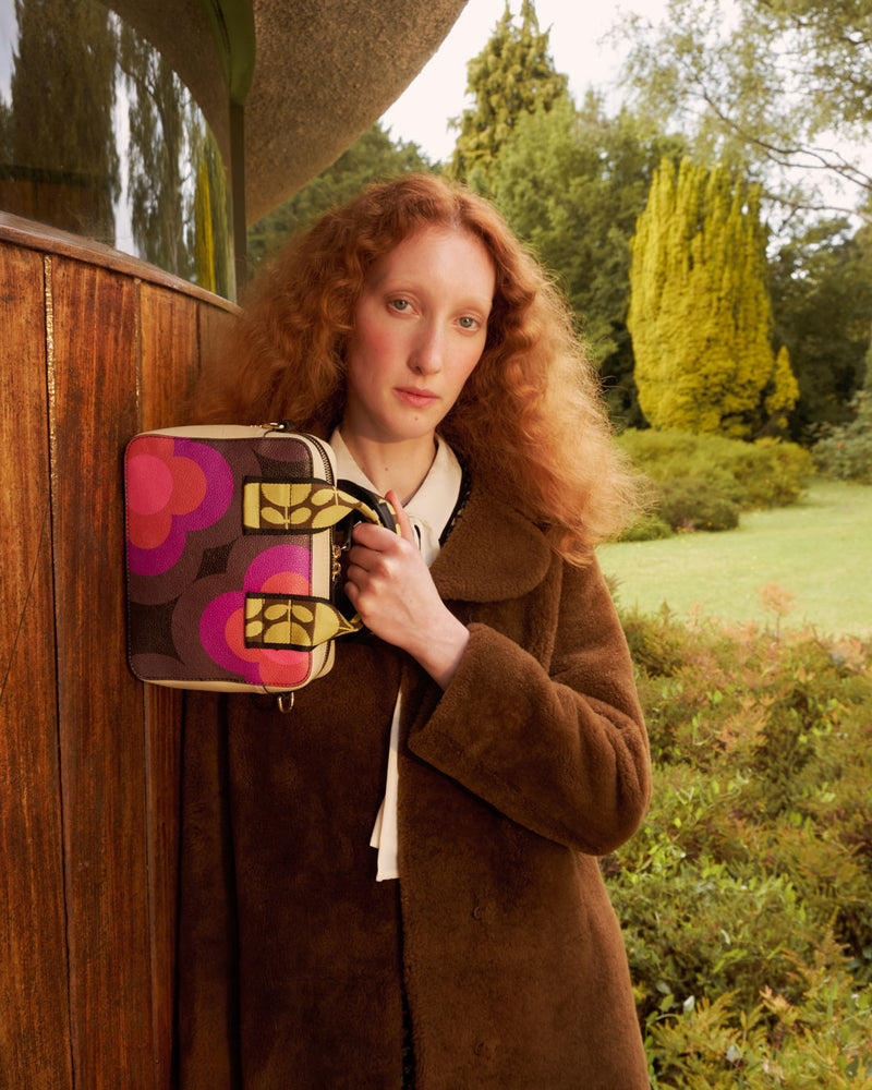 Model holding an Orla Kiely Minola Handbag 