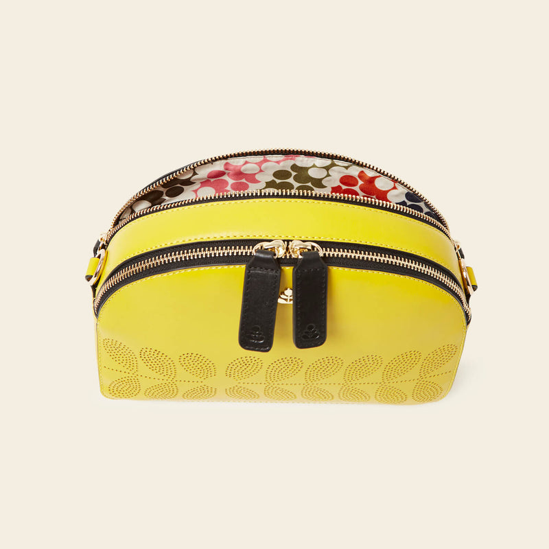 Luna Crossbody in Daffodil Punched Flower pattern by Orla Kiely