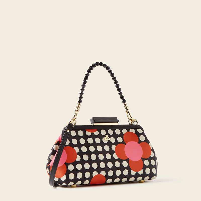 Jenny D Clutch Bag in Fuchsia Flower Polka Dot pattern by Orla Kiely