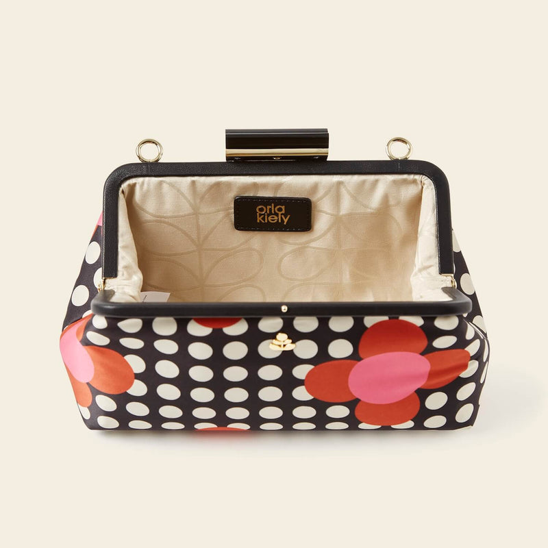 Jenny D Clutch Bag in Fuchsia Flower Polka Dot pattern by Orla Kiely