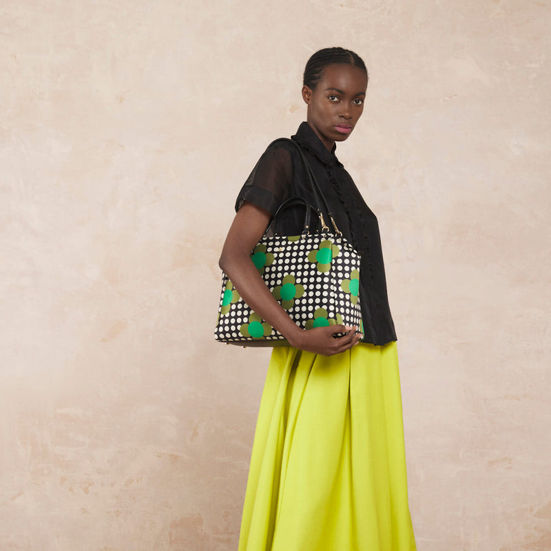 Model wearing the Opera Big Tote Bag in Jewel Flower Polka Dot pattern by Orla Kiely