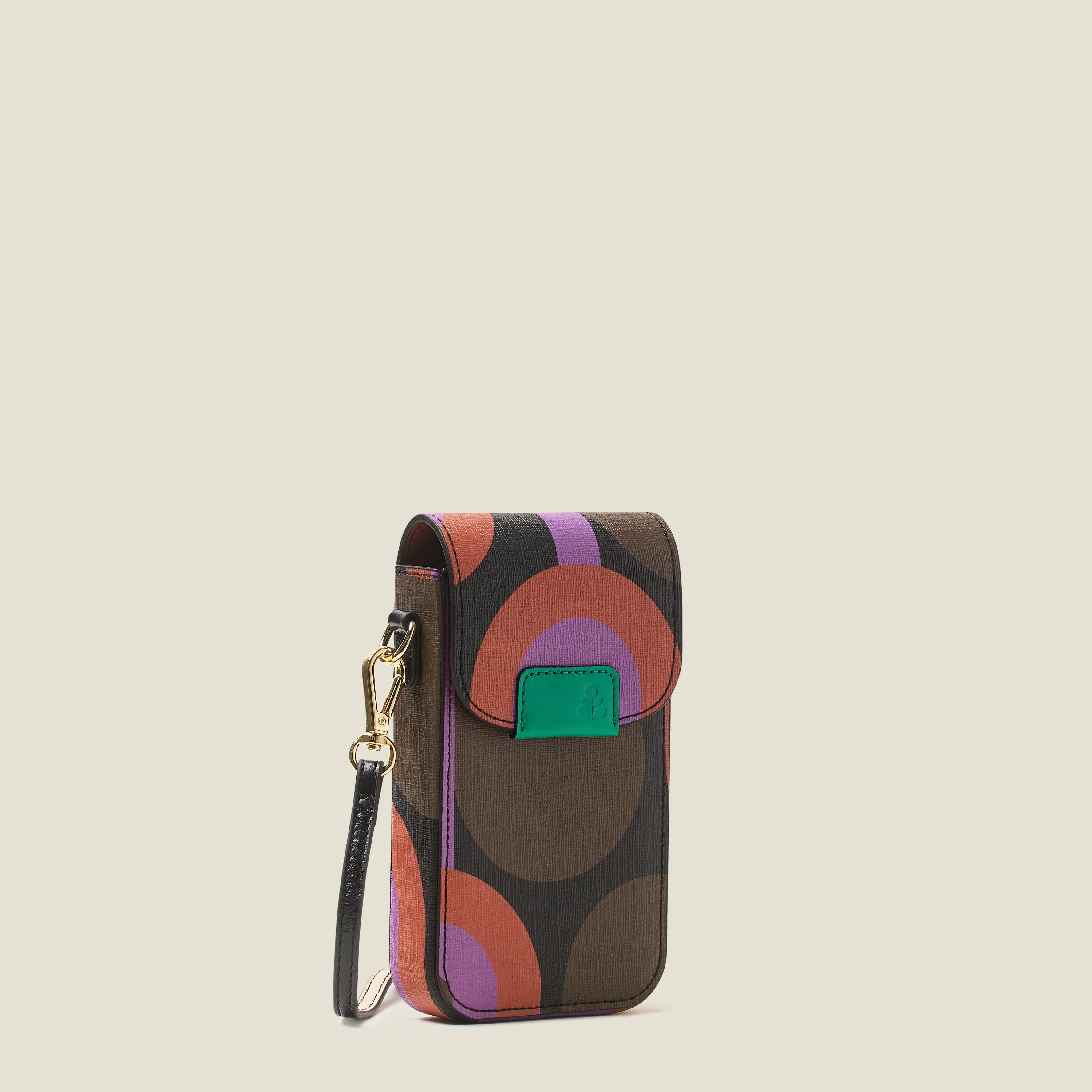Side view of a purple patterned phone pouch or bag with a crossbody strap and green leather trim branding on a beige background
