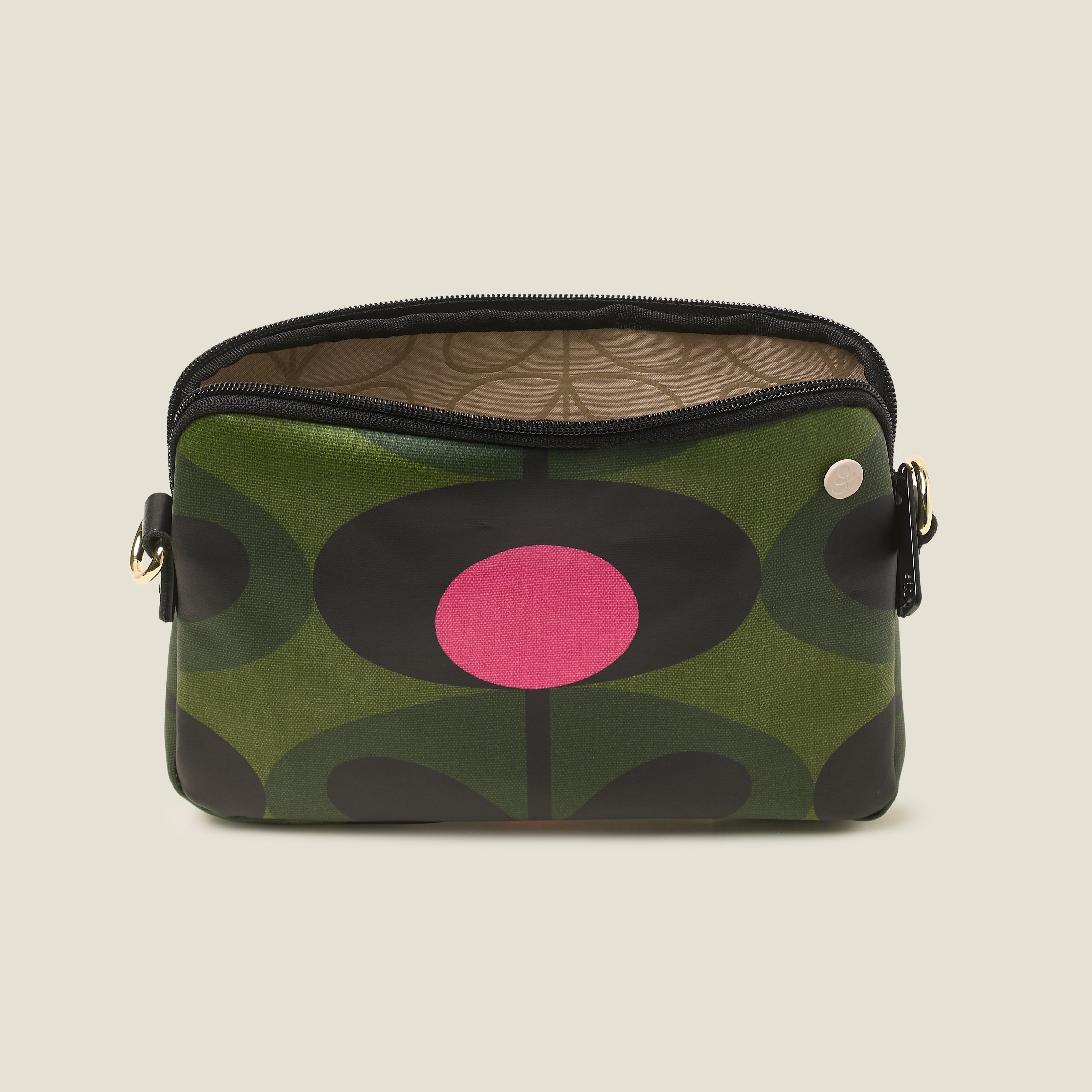 Top view of green patterned slim crossbody bag with a pink flower, zip closure and crossbody strap.