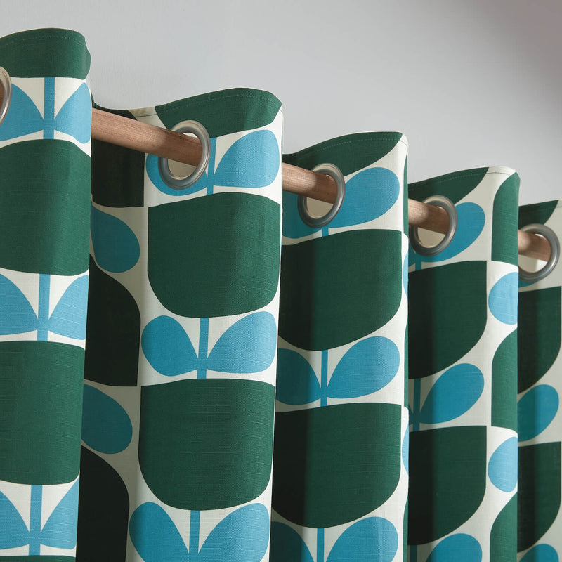 Lifestyle close up image of Orla Kiely's Block Stem Jade curtains in living room