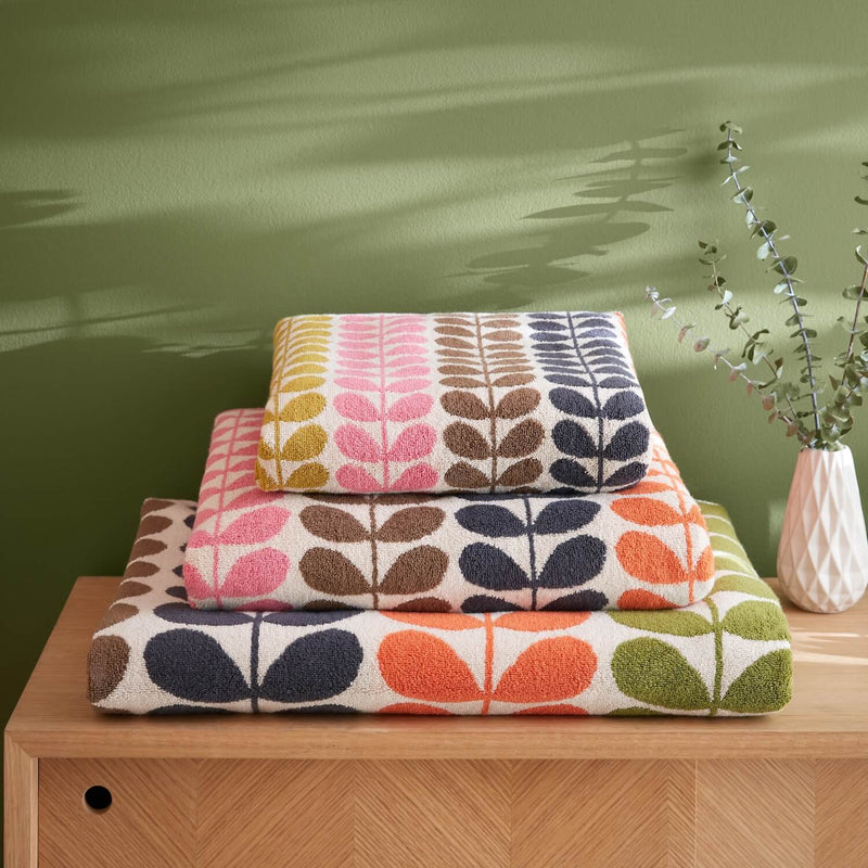 Lifestyle shot of Orla Kiely multi stem towels stacked