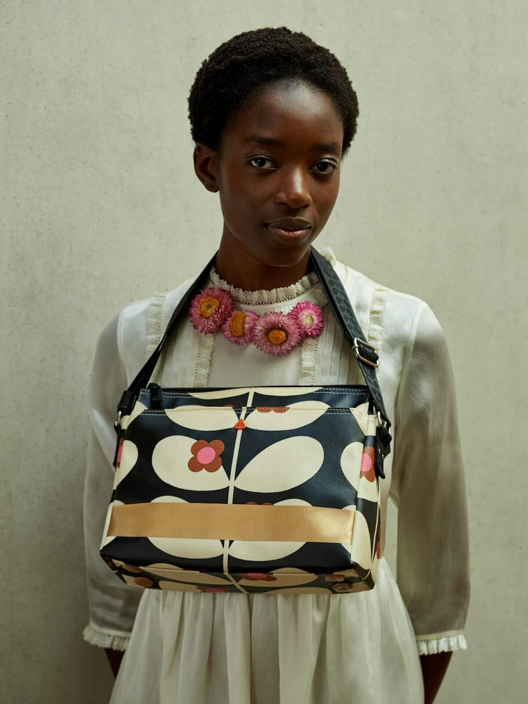 Wearing an Orla Kiely fielder bag like a necklace