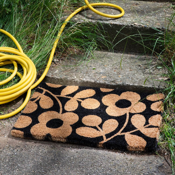 Lifestyle shot of outdoor Orla Kiely doormat in stem sprig jet