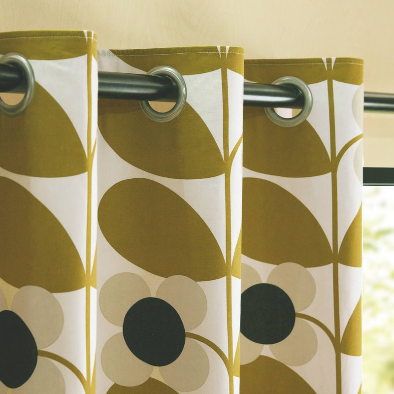 The eyelets of Orla Kiely's gold stem boom curtains