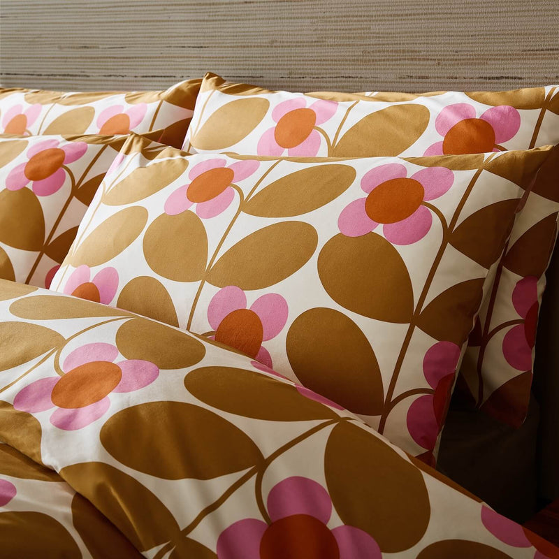 Lifestyle shot of saffron Orla Kiely stem bloom pillowcases