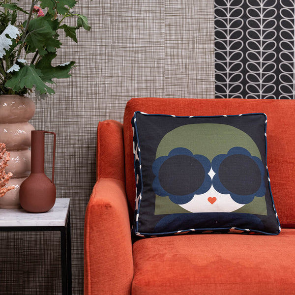 Lola Orla Kiely cushion on an orange chair