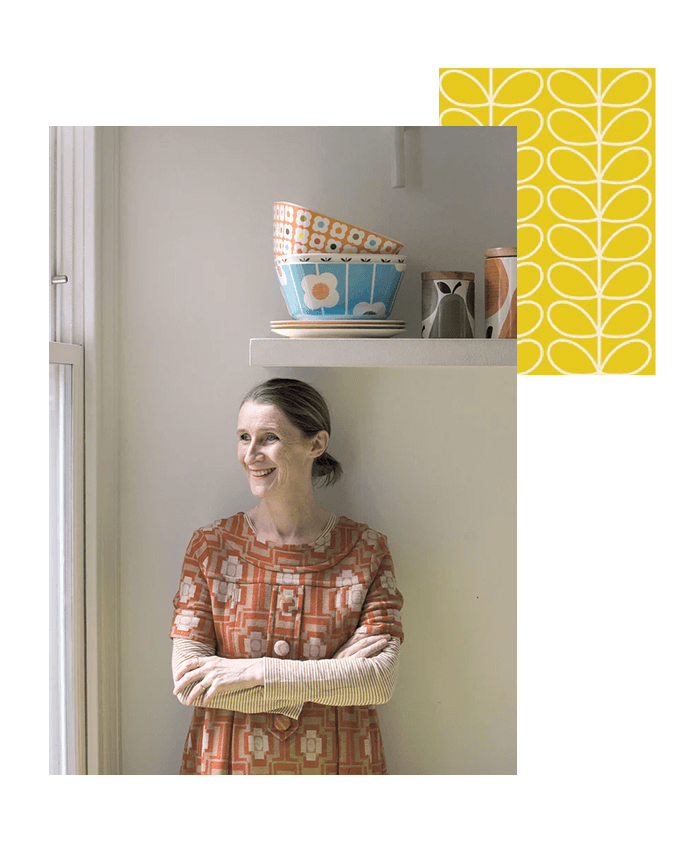 Orla Kiely standing under a shelf with her arms crossed